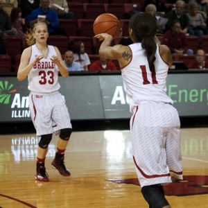 Freshman Madison Dellamuth drives toward the hoop in an exhibition game against Eureka College.