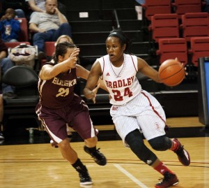 Junior Sameia Kendall drives to the hoop in the Nov. 7 exhibition game against Eureka College. Photo by Maggie Cipriano. 