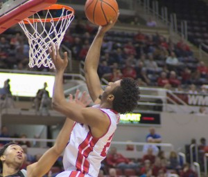 Junior guard Omari Grier rises above the Wichita State defense in Bradley’s loss to the Shockers Wednesday night. Grier finished with 12 points in the game for the Braves. Photo by Dan Smith.