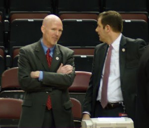 Outgoing Director of Athletics Michael Cross talks to current Associate AD for External Affairs Brett Burchette before the Bradley-Loyola game yesterday.