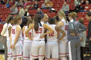 Head coach Michael Brooks gathers the team together to discuss strategy in a December loss to Chicago State. Brooks and the Braves won two of three road games. Photo by Dan Smith.