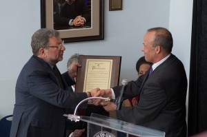 Charley Steiner accepts a framed proclamation from Peoria Mayor Jim Ardis at the dedication of the School of Sports Communication. Photo by Dan Smith.