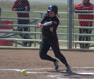Senior Brittany Burgess offers at a pitch against the Salukis in March. Burgess had the game-winning base hit against the Redbirds Wednesday. Photo by Dan Smith.