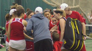 The Bradley women’s tennis team huddles during a match aganst IFPW March 7. The Braves lost 5-2. Photo by Dan Smith.