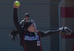 Senior Alyson Spinas-Valainis prepares to deliver a pitch against Loyola last month. Spinas-Valainis strug- gled with walks but picked up the win for the Braves in Sunday’s game against the Panthers. Photo by Dan Smith.