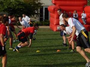 Student team members play against the faculty team in the Bradley Bowl flag football tournament Thursday. The faculty team won for the third year in a row. Photo by Chris Kwiecinski.