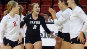 Lea Sack (2) celebrates a point scored in a game last year against Miami (Ohio). Sack, who plays libero for the Braves, was the Most Valuable player in the Toledo Rocket Tournament. Photo by Chris Kwiecinski.