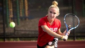 Sophomore Aimee Manfredo winds up for a backhand. She won the singles White Flight championship at the Cougar Invitational. Photo via BradleyBraves.com