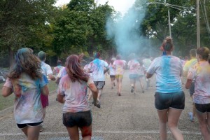 Runners at the Alpha Phi Omega Color the Way to Clean Water 5K throw colorful powdered paint at each other before the race began Saturday. Photo by Cliodhna Joyce-Daly.
