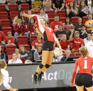 Freshman Erica Haslag rises for a kill in a match against DePaul. Photo by Ann Schnabel.