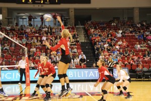 Sophomore Jamie Livudais rises for a spike during a game against DePaul. Livudais is third on the team in kills with 89. Photo by Adam Rubinberg.