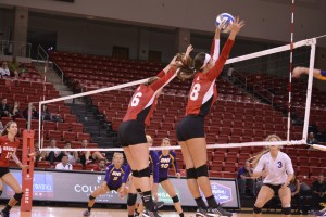 Cordelia Murphy (16) and Allison Turner (18) rise up for a block in a game earlier this season. Photo by Ann Schnabel.