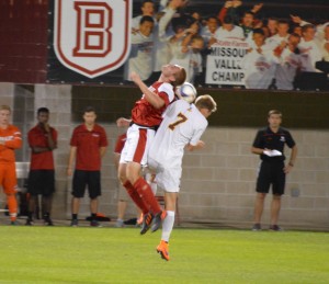 Sophomore defender Jacob Taylor goes up to challenge a Rambler player for a header during the Braves’ 1-0 homecoming win against Loyola Sept. 25. Photo by Anna Foley.