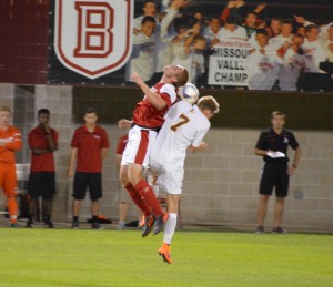 Sophomore defender Jacob Taylor goes up to challenge a Rambler player for a header during the Braves’ 1-0 homecoming win against Loyola Sept. 25. Photo by Anna Foley.