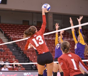 Taylor Thiele (13) rises for a spike during a game against Northern Iowa. Thiele has 111 kills on the year. Photo by Moira Nolan.