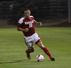 Grant Bell handles the ball in a game earlier this season. Bell is one of three seniors on the Bradley soccer team. Photo by Ann Schnabel.