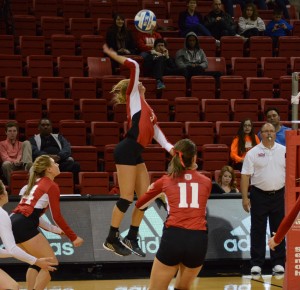 Bradley’s Erica Haslag (center) rises for a spike in a game agaisnt Wichita State. Haslag has the sixth most kills in a season for a Bradley freshman. Photo by Anna Foley.