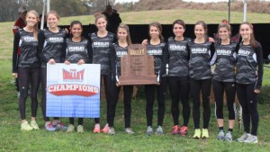The Bradley women's cross country team pose with their conference champion trophy after winning their conference meet in Evansville, Indiana.