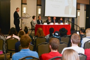 Fellows member Jason Blumenthal moderates the panel filled with community leaders Thursday in the Hayden-Clark Alumni Center Ball- room. Photo by Katlyn Gerdes.