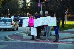 Members of Feminists at Bradley and the community gathered at the corner of Main Street and University Street to show support for Planned Parenthood in the wake of the Colorado Springs shooting. Photo by Ann Schnabel.