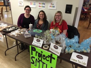 Students from the ETE 445 class work a bake sale to raise money for Crittenton Center Nursery. Photo by Anna Foley.