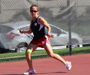 Sophomore Aimee Manfredo returns a ball during the Bradley Invitational in September. Manfredo only lost one singles match during the fall season. Photo by Anna Foley.