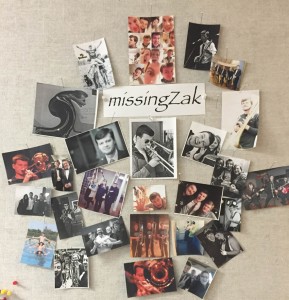 Molly Sloter, staff accompanist in the Department of Music, displays pictures of Zak Haubrich on a bulletin board outside her office in Constance Hall. Photo by Tori Moses.