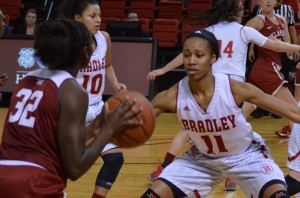 Bradley forward Tamya Sims plays defense against a player from Oklahoma University during a game against the Sooners last year. Photo by Anna Foley.