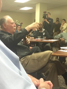 At the discussion Wednesday titled “The future of the Supreme Court: Why it matters who wins the 2016 presidential election,” an attendee asks Craig Curtis, acting director of the Pre-Law Center, a question. Photo by Tori Moses.
