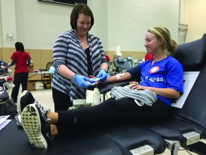 Students donate pints of blood in exchange for pints of Culver’s ice cream at this year’s Greek Week blood drive. Photo by Ann Foley.
