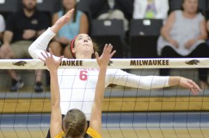 Senior Kelsey Cave is in mid-flight, preparing to spike the ball into the opposing zone. Cave is hitting .378 this year, best on the team this year. Photo via bradleybraves.com.
