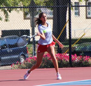 Sophomore Malini Wijesinghe prepares to rip a forehand in a match last year. Photo by Ann Schnabel.