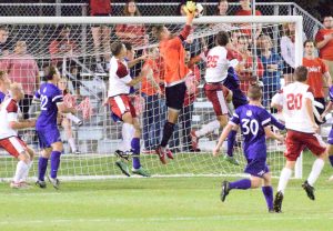 Bradley players rise up in an attempt to head a ball into the net from a corner kick, but the attempt is saved. Photo by Justin Limoges.
