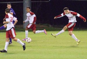 Junior Richard Olson strikes a ball toward net against Evansville. Olson has three goals this season. Photo by Anna Foley.