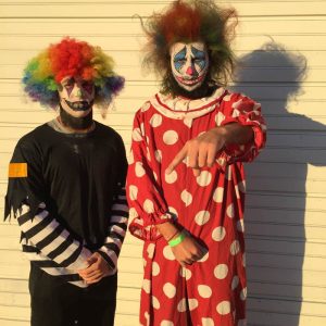 Senior community wellness major Dakota Bullard, left, and ICC land- scape design student Christian Lane, right, dress as scary clowns while volunteering for a haunted house at Three Sisters Park. Photo via Christian Lane. 