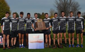 The men’s cross country team poses with the Missouri Valley Conference first place trophy last weekend in Cedar Fall, Iowa. photo via bradleybraves.com