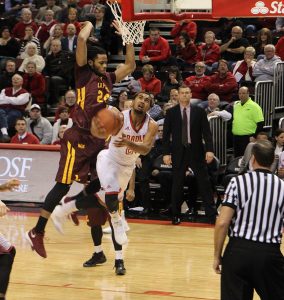 Sophomore Dwayne Lautier-Ogunleye goes up for a contested layup in a game last year against Loyola. photo via Scout Archives