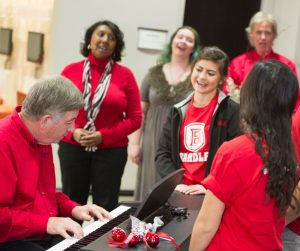 Students sing carols at the holiday party held last year in the Hayden-Clark Alumni Center. photo by Duane Zehr