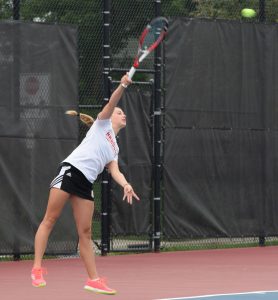 Sophomore Lindsay Haight serves to her opponent in the Bradley Invitational last fall. ￼Photo by Justin Limoges