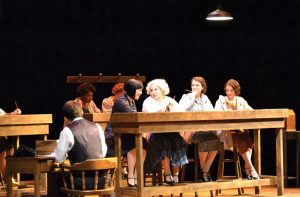 Students act in “These Shining Lives,” a play about women who fell ill from radium-related health issues at a company in Ottawa, Illinois. photo by Cenn Hall