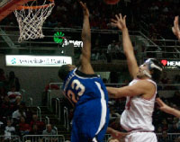 Senior Sam Singh attempts a put-back over an Indiana State defender in the Braves’ 68-56 victory on Saturday night. Photo by Megan Loos
