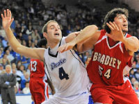 Senior Sam Singh battles in the post to prevent Drake’s Brent Heemskerk from receiving the ball. Bradley lost the game 68-54. courtesy of Drake University. Photo by Chris Donahue