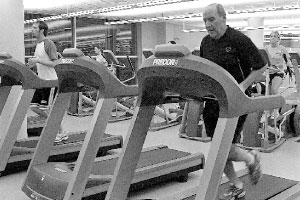 Men’s soccer assistant coach Jeff Gettler uses a treadmill in the Markin Center. Faculty and staff pay an annual fee to use the Markin Center, but can now receive free health screenings. The screening include a questionnaire as well as a consultation.