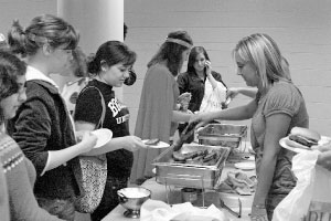 Students line up for free food during a Late Night BU last semester. The next Late Night BU has a Mardi Gras theme and it will feature a petting zoo, caricatures, cards games and more.