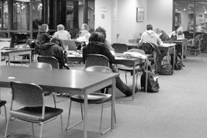 Students study at tables in the Cullom-Davis Library. A committee has drafted a proposal, asking for $50,000 to $60,000 to improve printing and $80,000 to $90,000 to bring lighting up to standards. Other priority renovations include the addition of outlets and circuits. Photo by Megan Loos