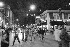 Students walk the streets near U of I during Unofficial St. Patrick’s Day last year. Many Bradley students travel to Champaign for the celebration. The event is centered on drinking and underage drinking, a police officer at U of I said. Photo courtesy of Scout archives