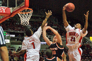 Junior Chris Roberts skies for a rebound in Wednesday’s 59-49 win over Pacific. Roberts finished with a team-high seven rebounds in the win. Photo by Megan Loos