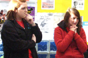 Junior Trisha Koors, a candidate for student body secretary, and junior Jade Peters, a candidate for vice president, wait patiently for the election results on Tuesday. There are clear winners in the races for two positions, but vice president and president will be decided in a runoff. Photo by Adam Moulton
