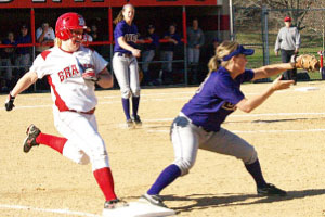 Freshman Julie Sherman is thrown out at first base in Wednesday’s 1-0 loss to UNI. Photo by Megan Loos