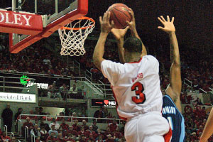 Freshman guard Darian Norris attempts a layup during the finals of the inaugural CollegeInsider.com Postseason Tournament. Norris later announced he plans to transfer. Photo by Megan Loos
